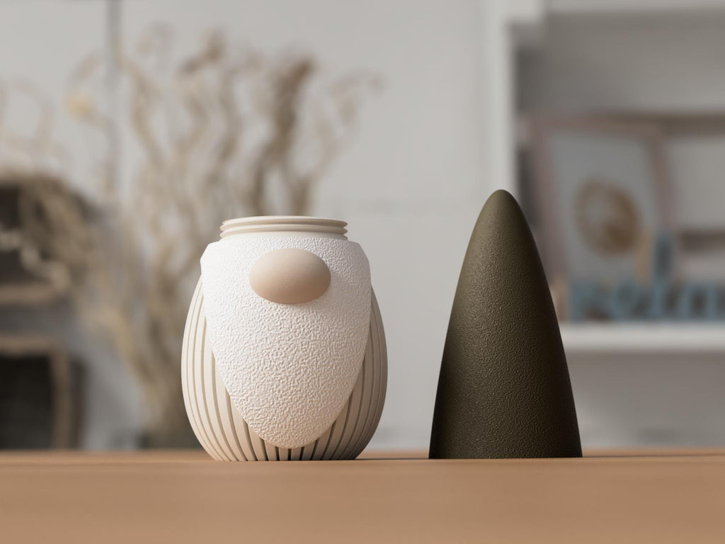 Two ceramic vases on a wooden surface with a blurred indoor background